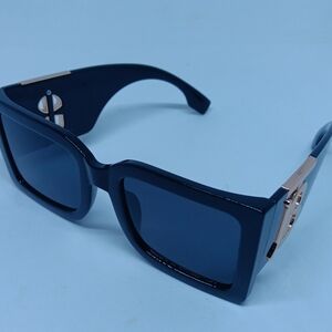 Burberry Stylish Black Sunglasses with Gold Accents
